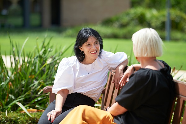 two people on a bench